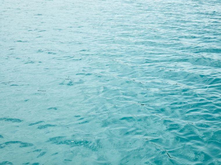 Clear turquoise ocean water with gentle surface ripples