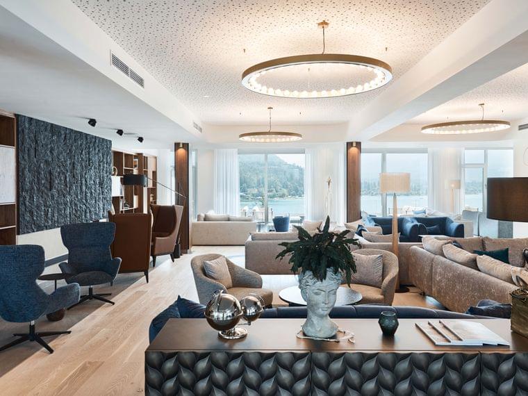 Modern hotel lounge with designer furniture and panoramic lake view