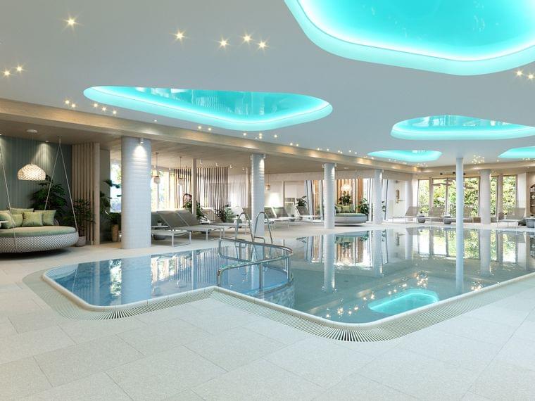 Luxuriöser Innenbereich mit Spa-Pool, Liegestühlen, Hängesesseln und stimmungsvoller Deckenbeleuchtung