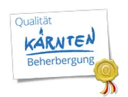 Quality seal for Carinthia accommodation with gold badge and ribbon
