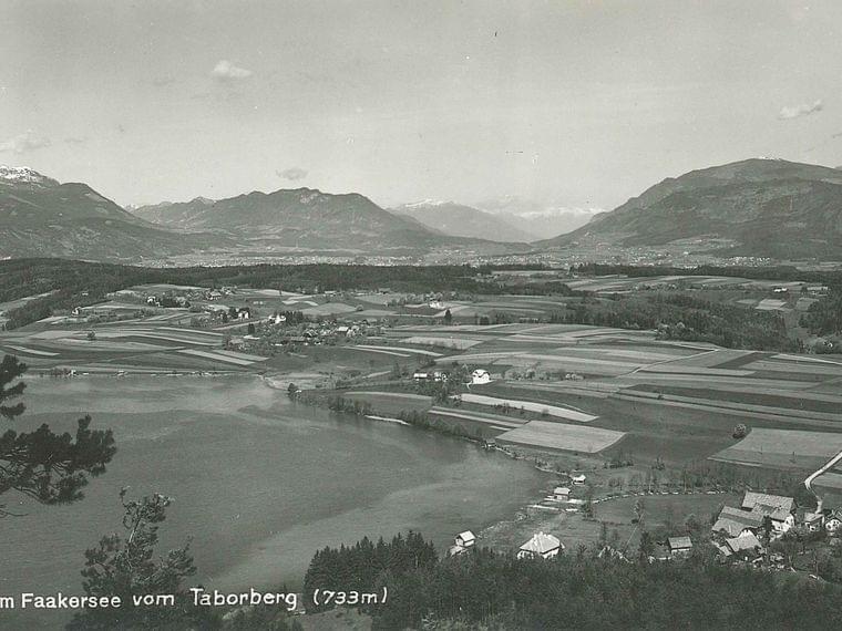 Aerial view of Egg am Faaker See with fields, lake, and mountains from Taborberg at 733 meters