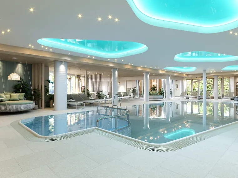 Luxuriöser Innenbereich mit Spa-Pool, Liegestühlen, Hängesesseln und stimmungsvoller Deckenbeleuchtung